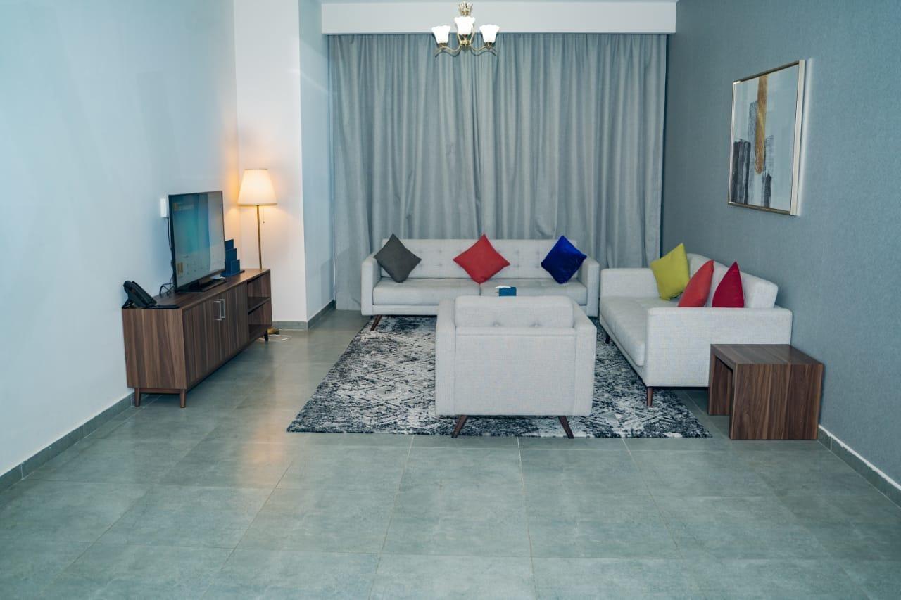 Luxe Grand Hotel Apartments Sharjah Exterior foto A living room
