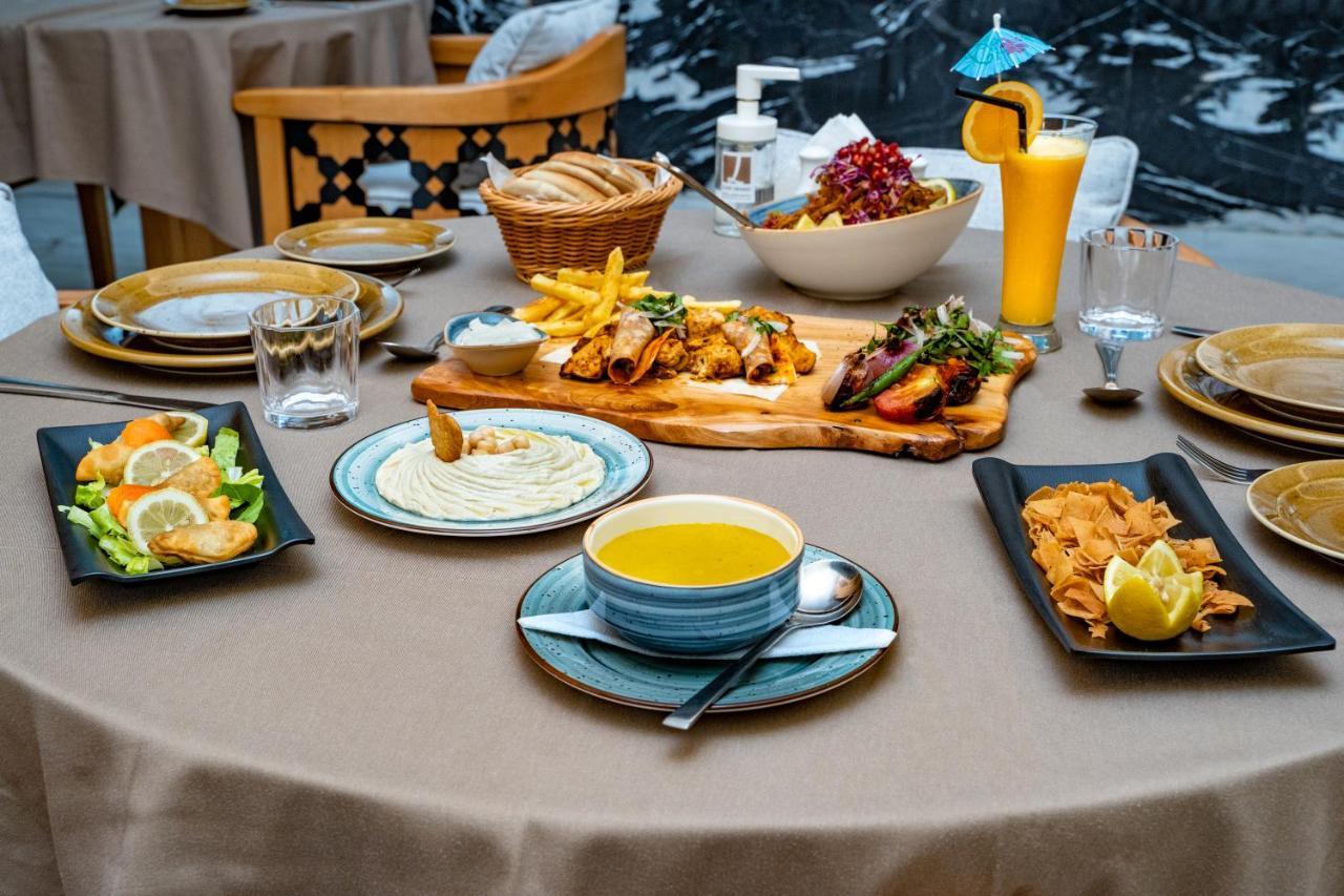 Luxe Grand Hotel Apartments Sharjah Exterior foto A selection of Turkish cuisine